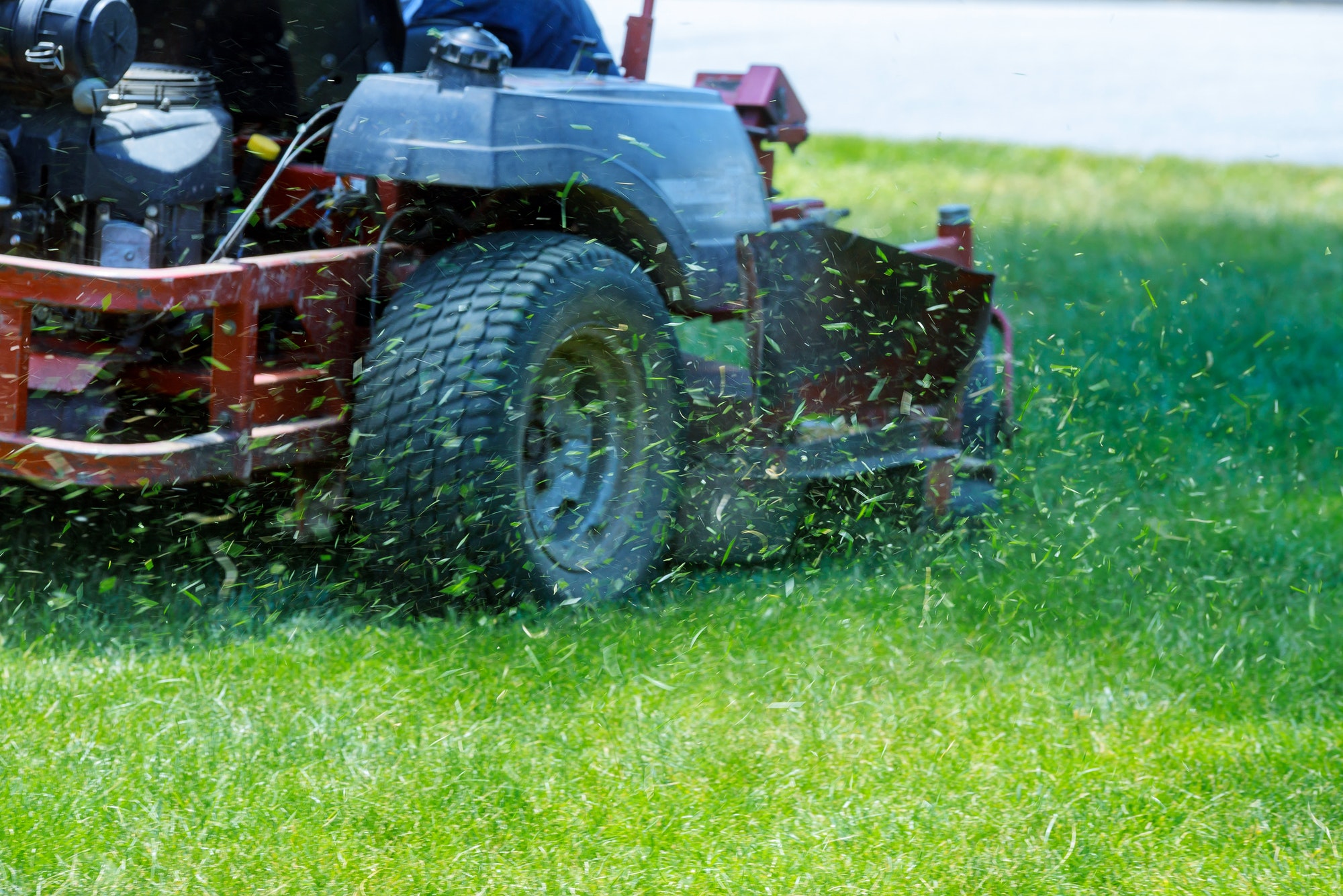 Red Lawn mower cutting grass